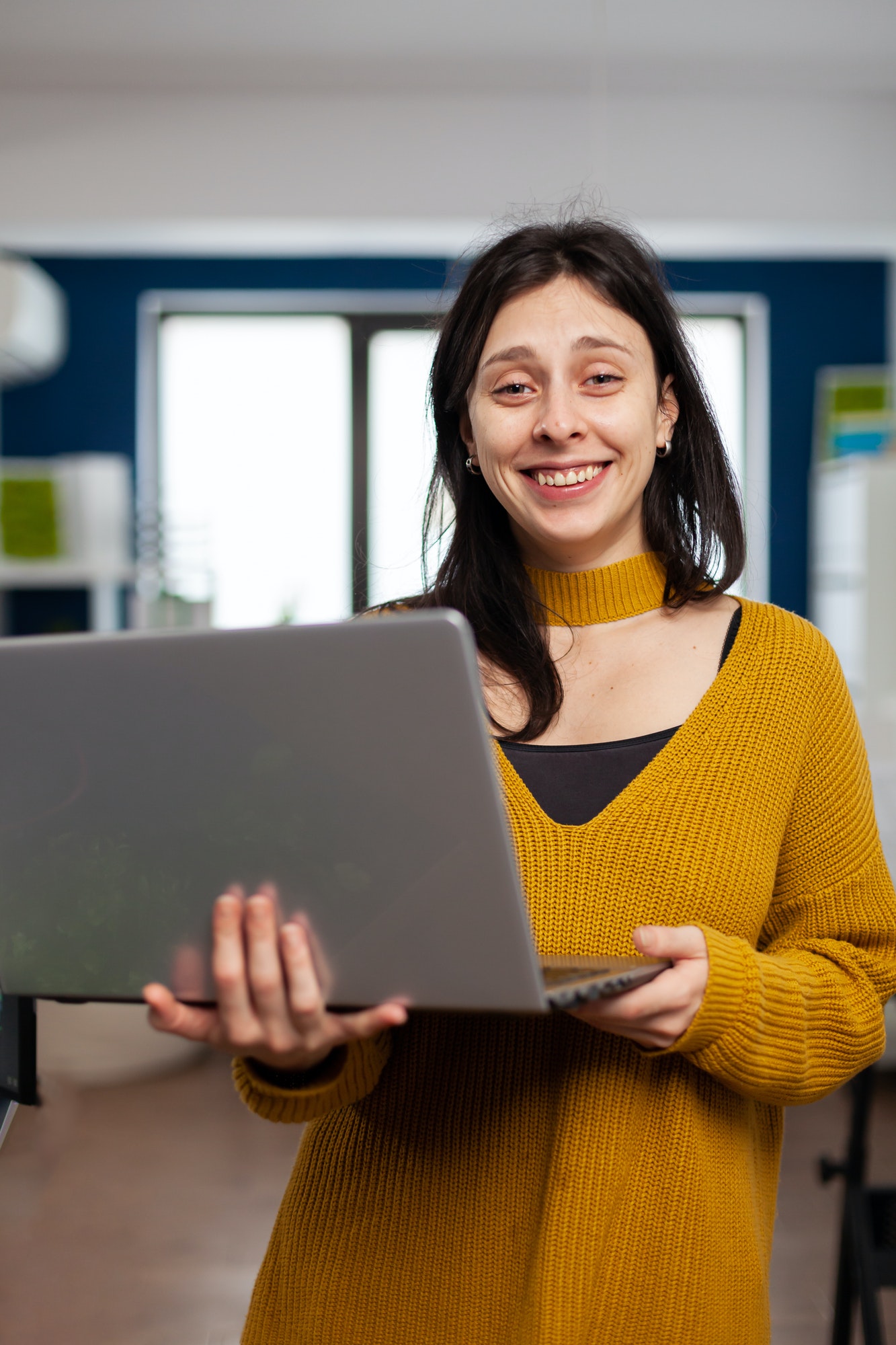 woman-retoucher-looking-at-camera-smiling-working-in-creative-media-agency.jpg